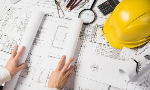 crop-architect-opening-blueprint