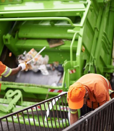 Men, garbage truck and city container for collection service for public pollution for recycling, waste management or trash. Community worker, teamwork and plastic in New York for junk, refuse or dirt.